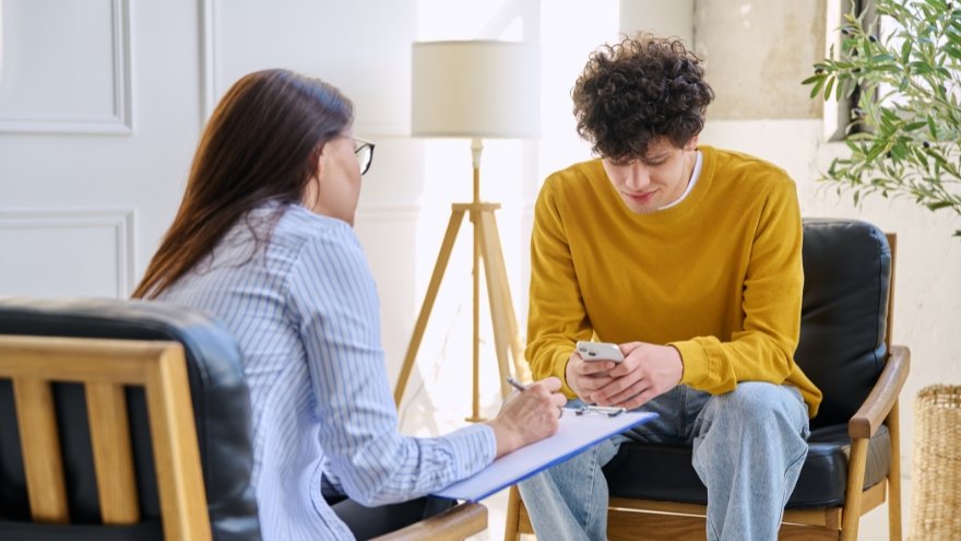 Licensed clinician working with teen patient