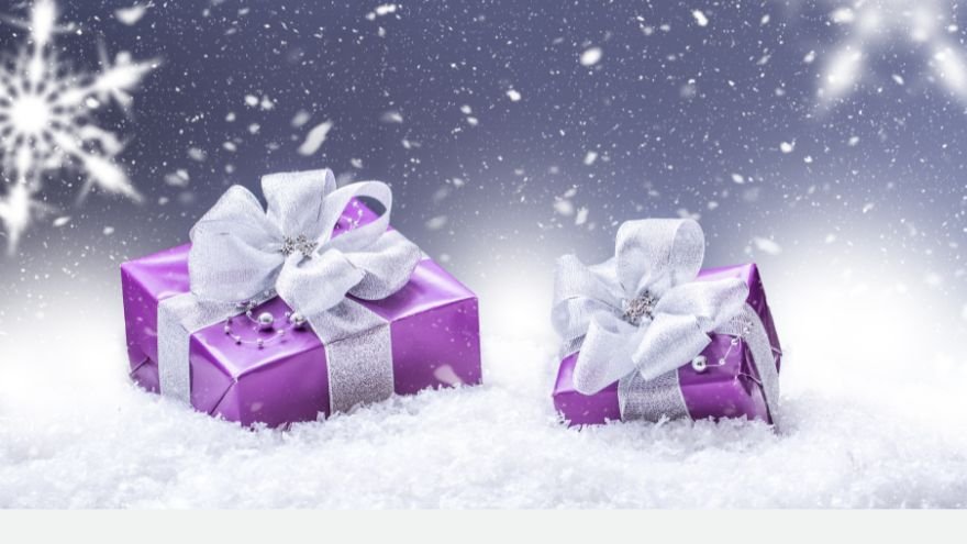 Presents wrapped in purple paper in snow scene