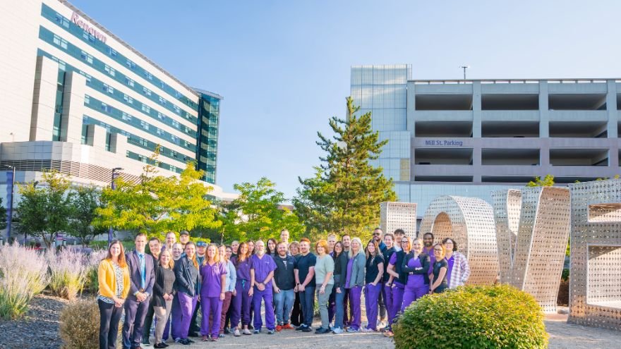 Renown Regional ER team stand out from of the hospital near the LOVE sculpture