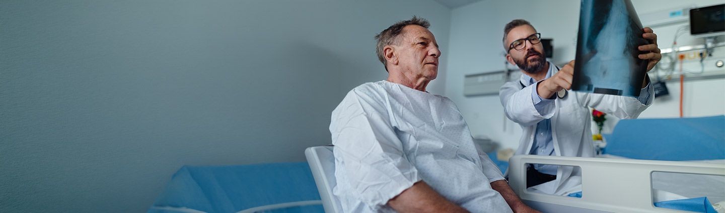 Doctor reviewing lung scans with patient