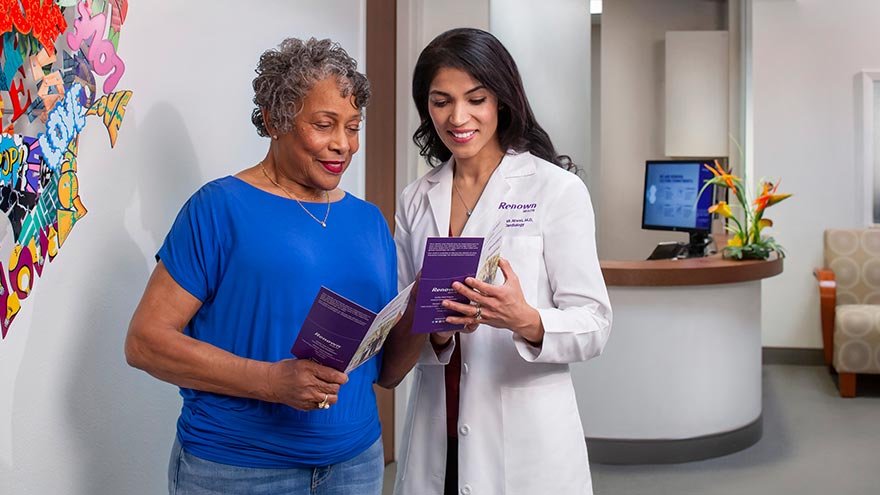 Dr. Atwal assisting patient