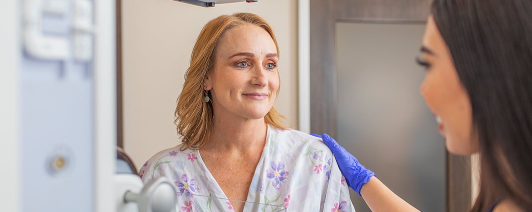 Patient at Renown with provider prepping for mammogram