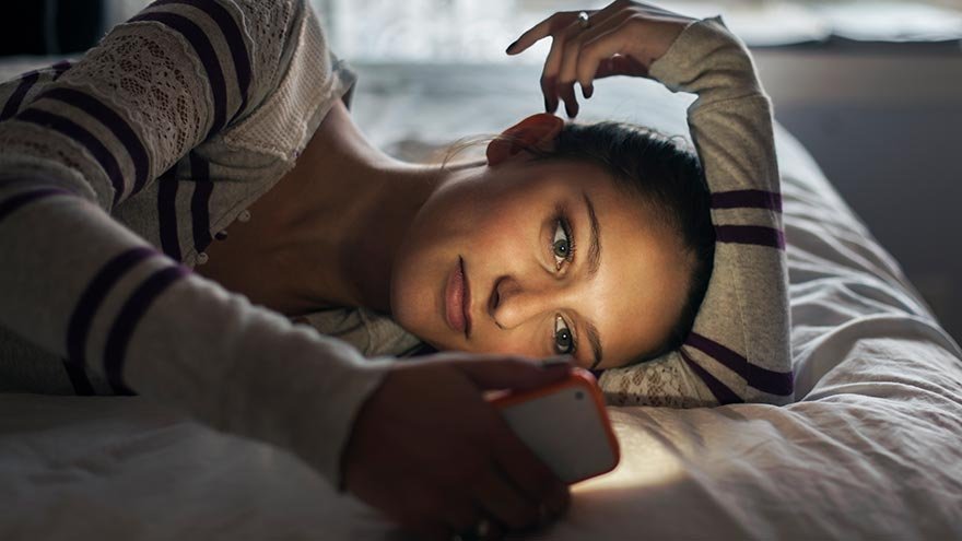 A woman looking at a phone