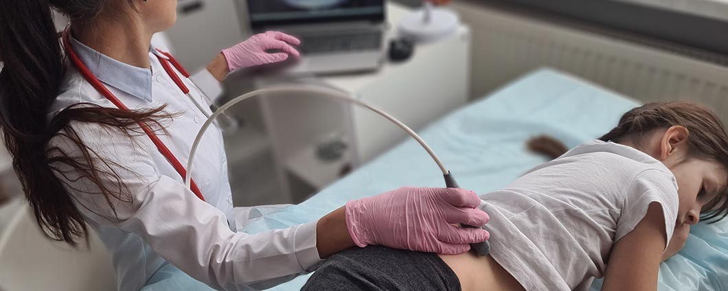 Nephrologist with pediatric patient