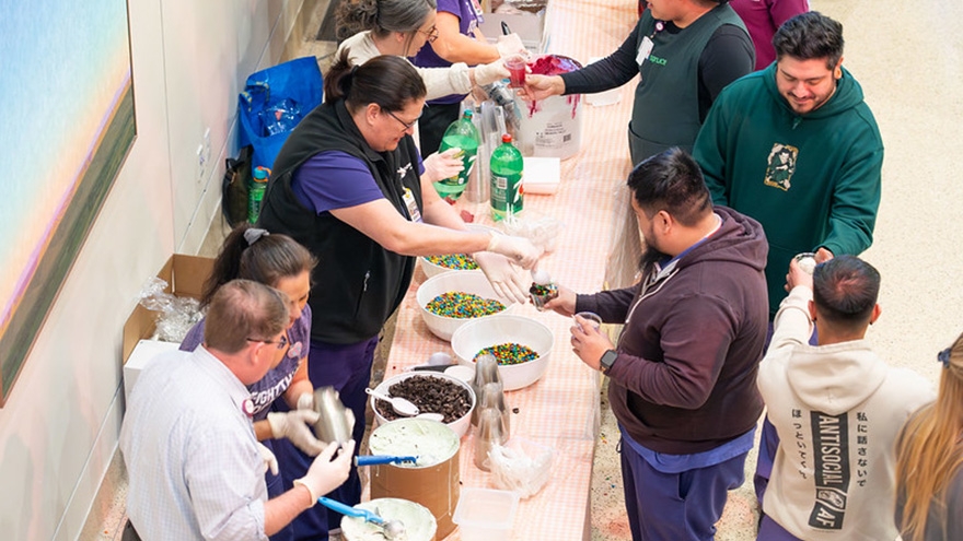 Volunteers serving food at an employee event