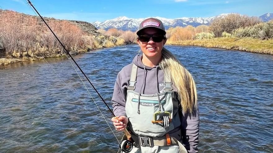 Woman holding fishing pole