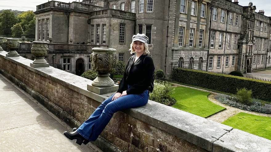 Ella Green posing in front of building