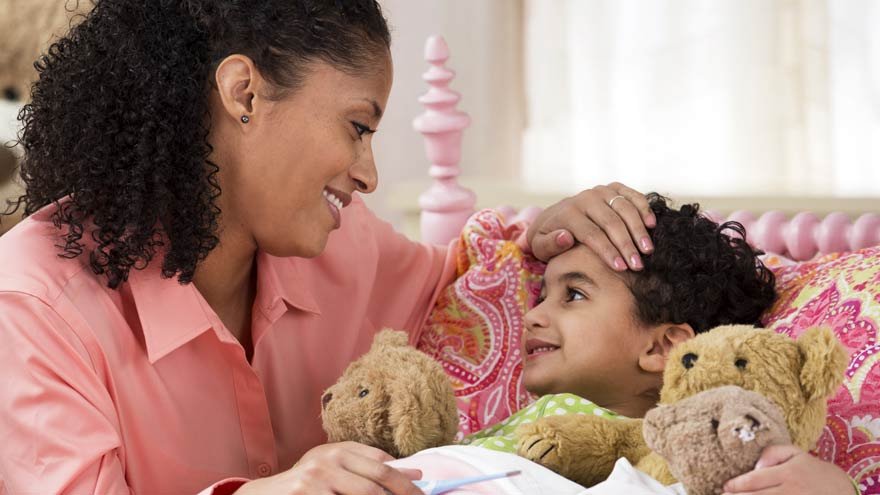 A lady and a child smiling at each other