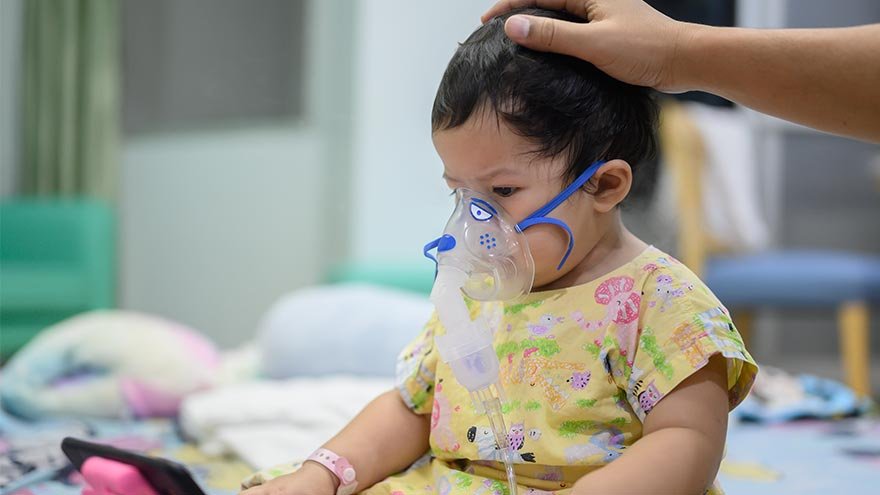 Infant with oxygen mask on