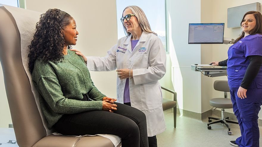High-risk Breast Center patient speaking with provider during appointment
