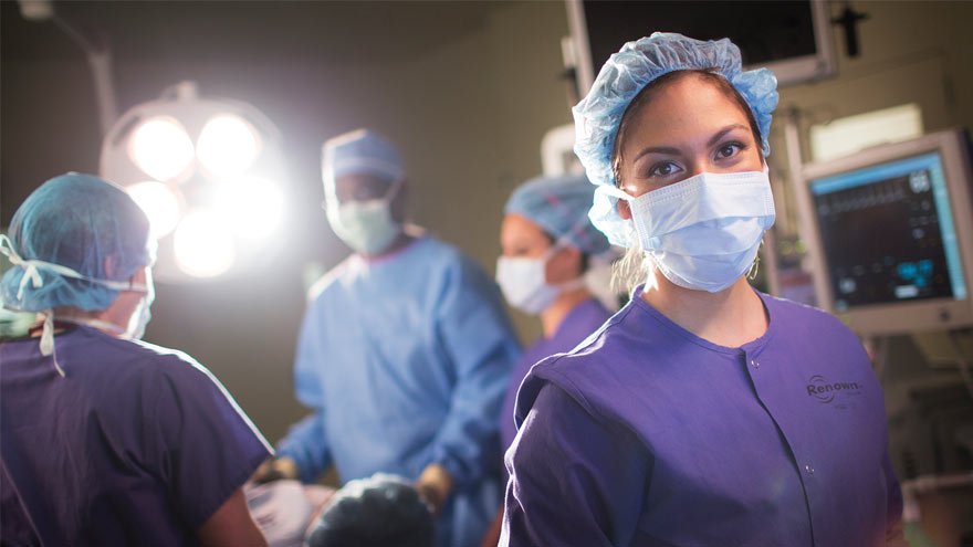 Operating room with four doctors in it