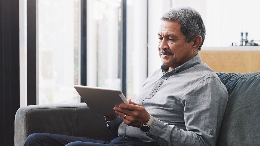 Man looking at tablet
