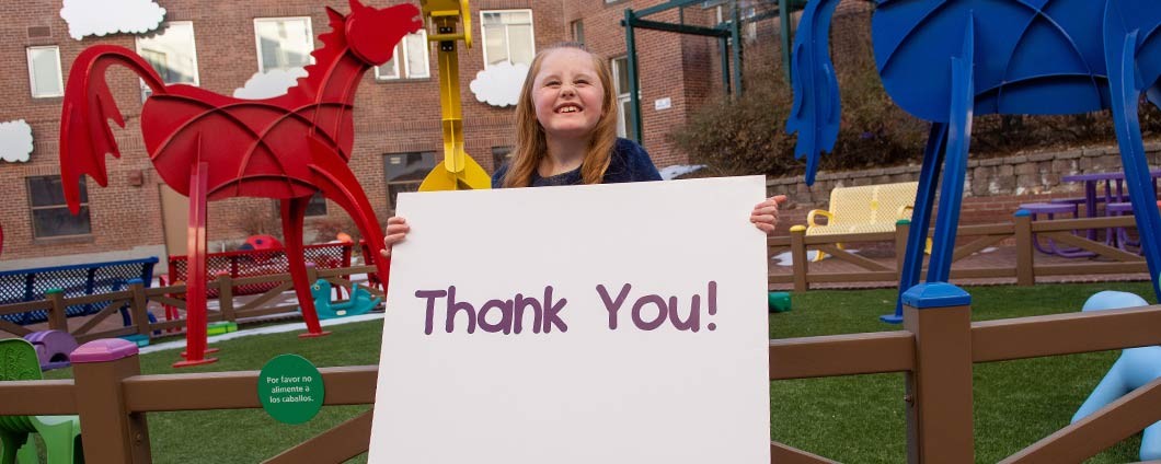 Shaylie holding thank you sign