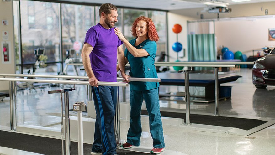 Renown Health rehab therapist assists patient