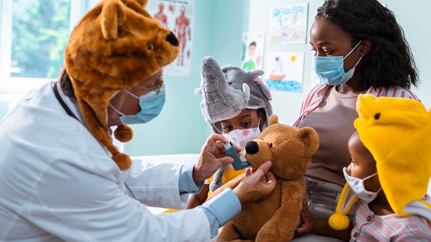 Close up of a mother and her little girls having an appointment with the urgent care provider