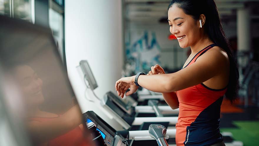 woman running on treadmill
