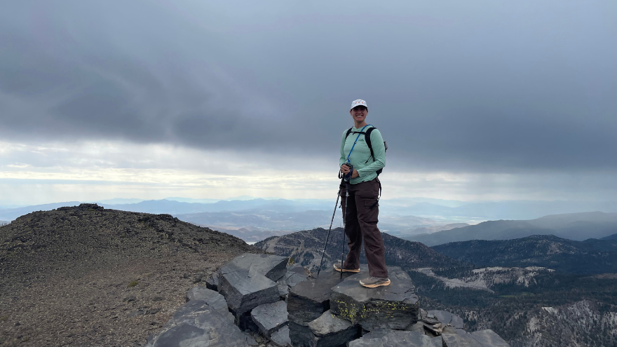 Woman standing on mountain with view