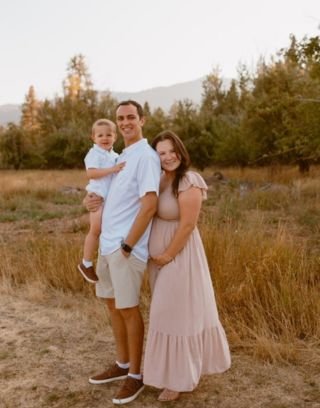 Alex and family posing for photo outside