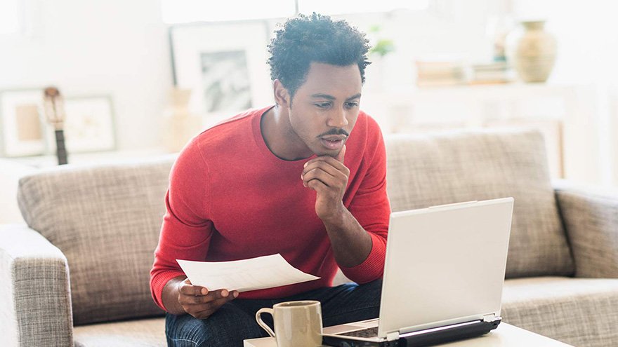 man looking at computer