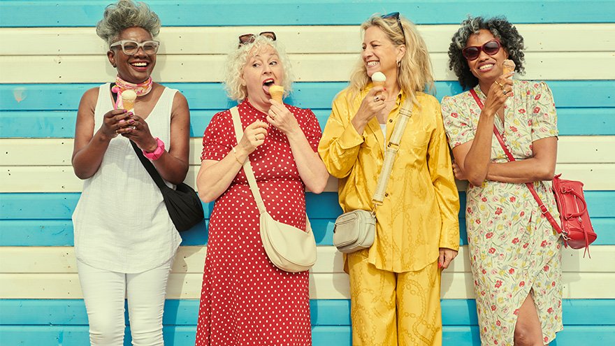 Women having fun eating ice cream cones