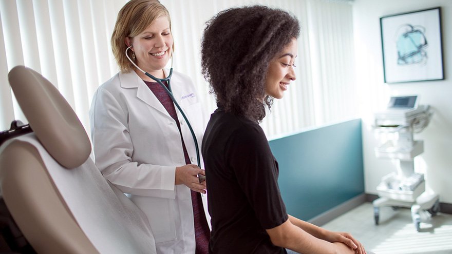 A doctor examining a child 