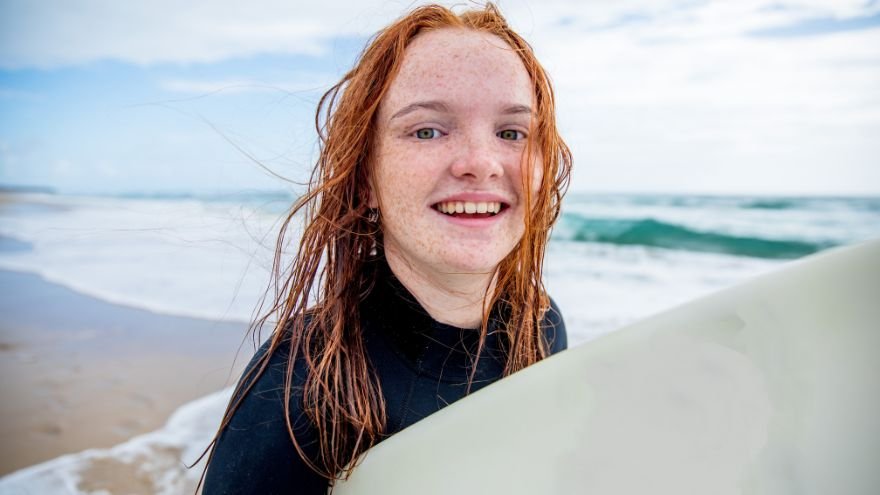 Teen girl surfing