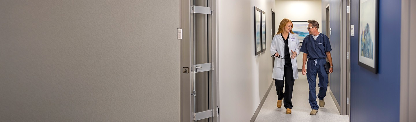 Urgent Care providers walking down hallway