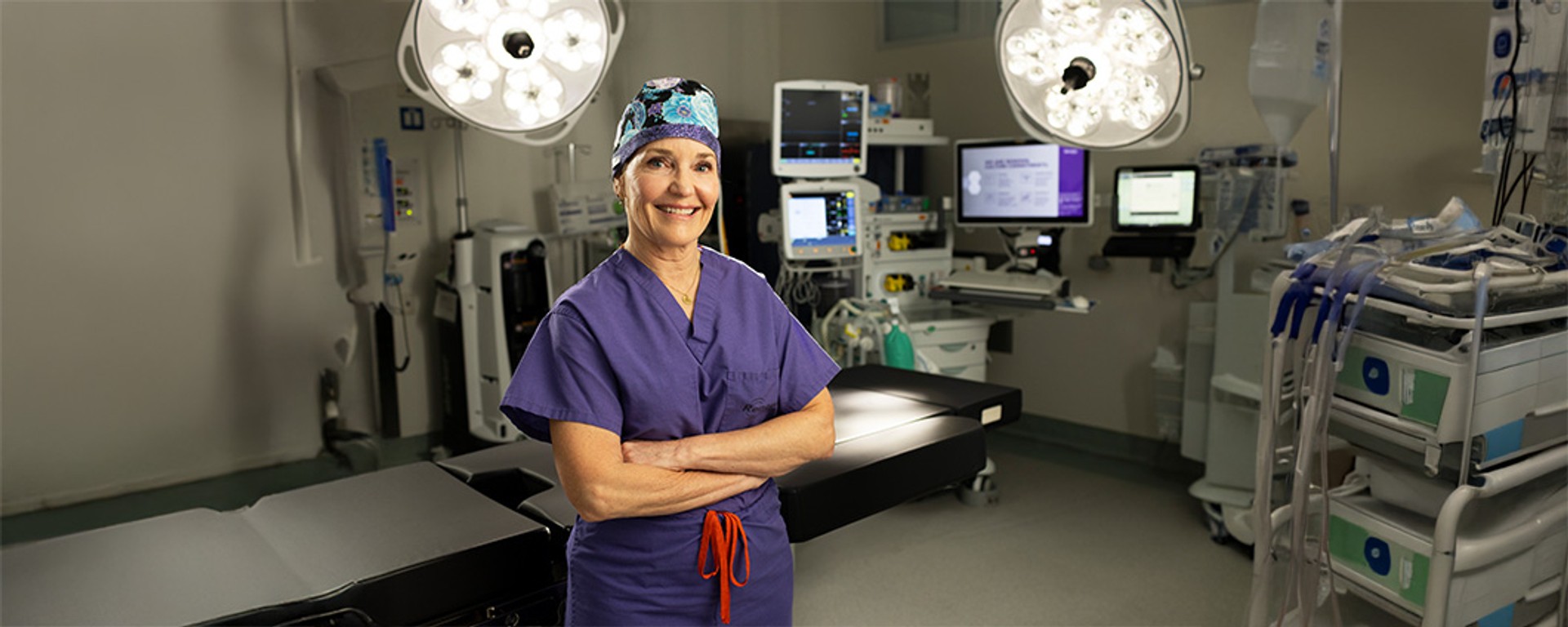 Renown Gastroenterologist posing in operating room