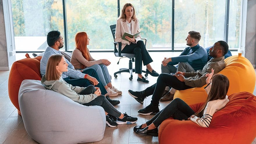 Adults participating in a group therapy session