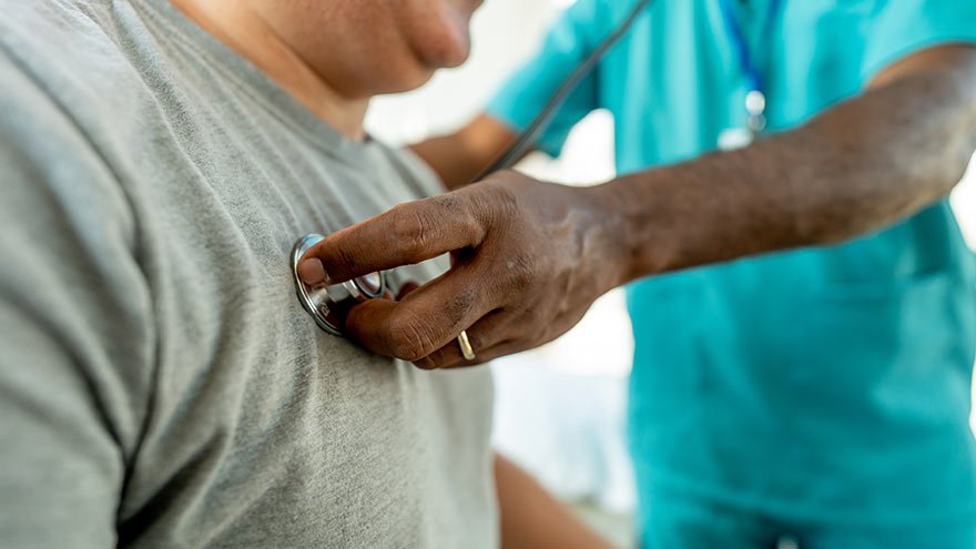 Provider listening to heart beat of patient