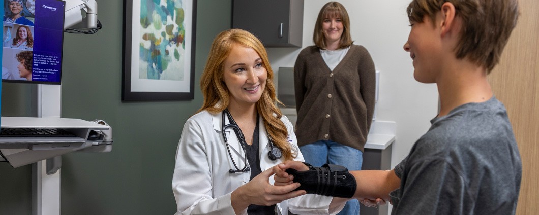 Renown provider treating young patient as mom looks on