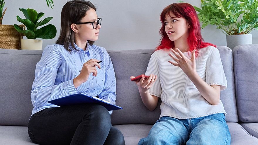 Teen talking with therapist