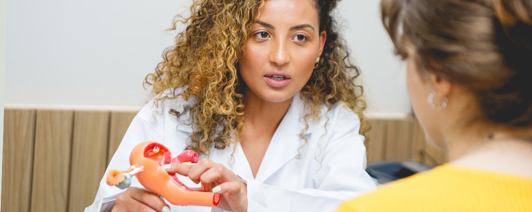Provider discussing women's health care with patient