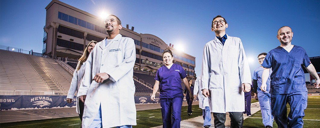Medical students walking at Mackay Stadium at the University of Reno, Nevada