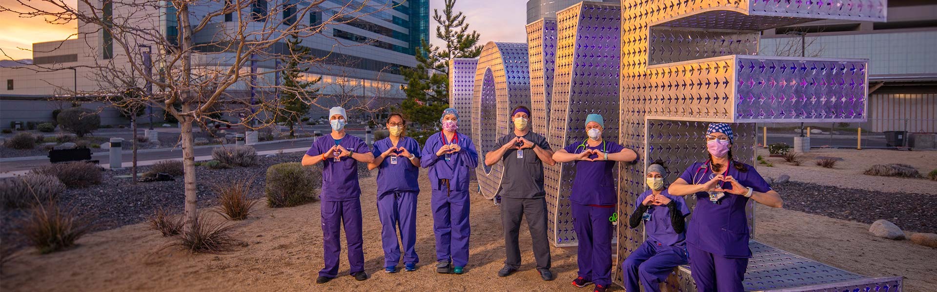 Renown nurses standing in front of the LOVE sculpture