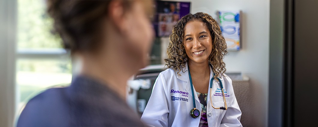 Dr. Germain speaking with other staff member