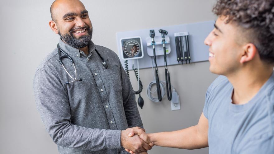 Dr. Reddy consulting with patient