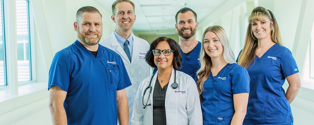 Renown providers in a group smiling for camera
