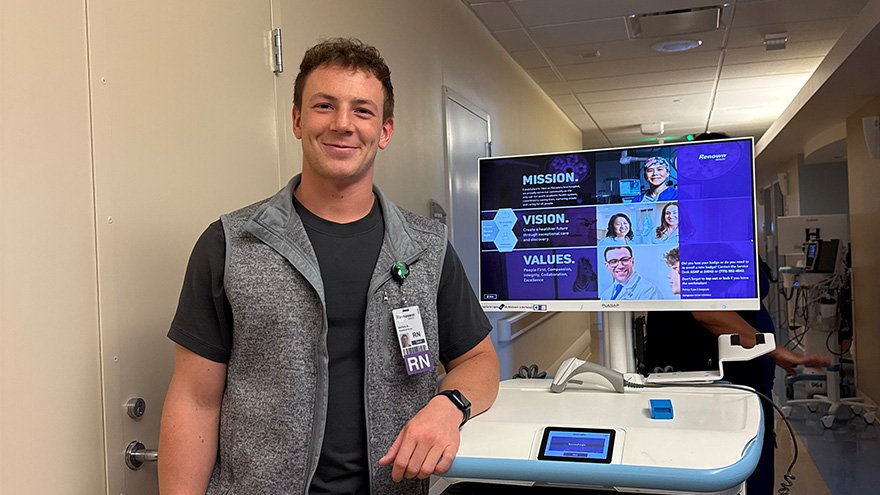 Zach Burns posing with mobile computer.