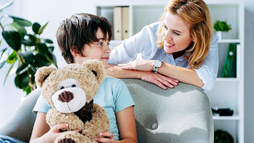 Therapist assessing child with Autism