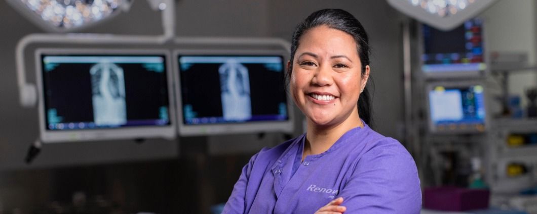 Operating room with four doctors in it