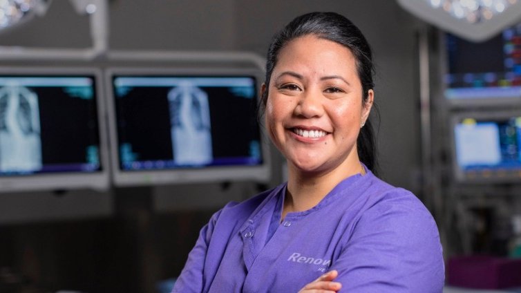 Operating room with four doctors in it