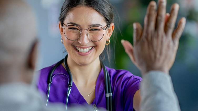 A provider high-fives her patient