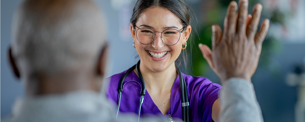 A provider high-fives her patient