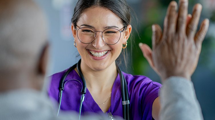 A provider high-fives her patient