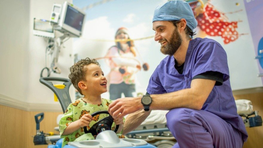 Nurse With Child Patient at Renown Health