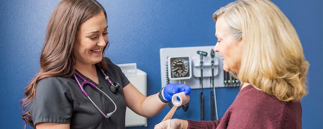 Pediatric doctor talking to little girl patient