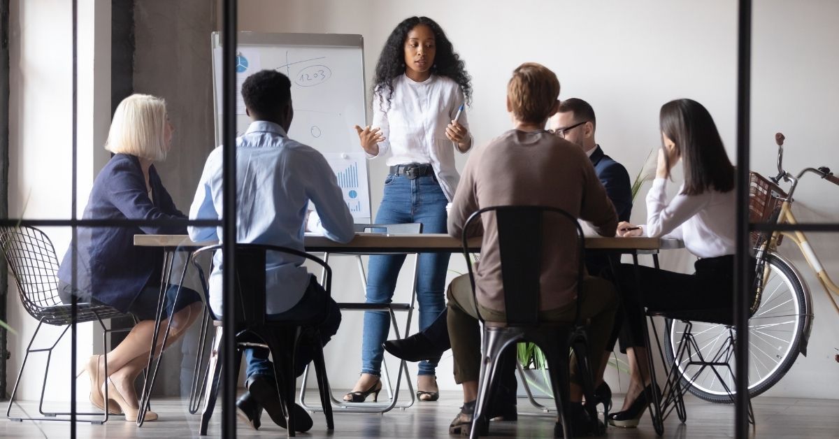 A team collaborating openly in a meeting