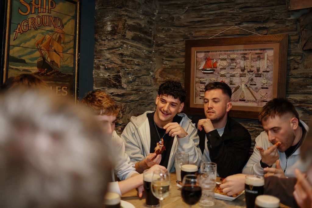 A table of friends eating and drinking together