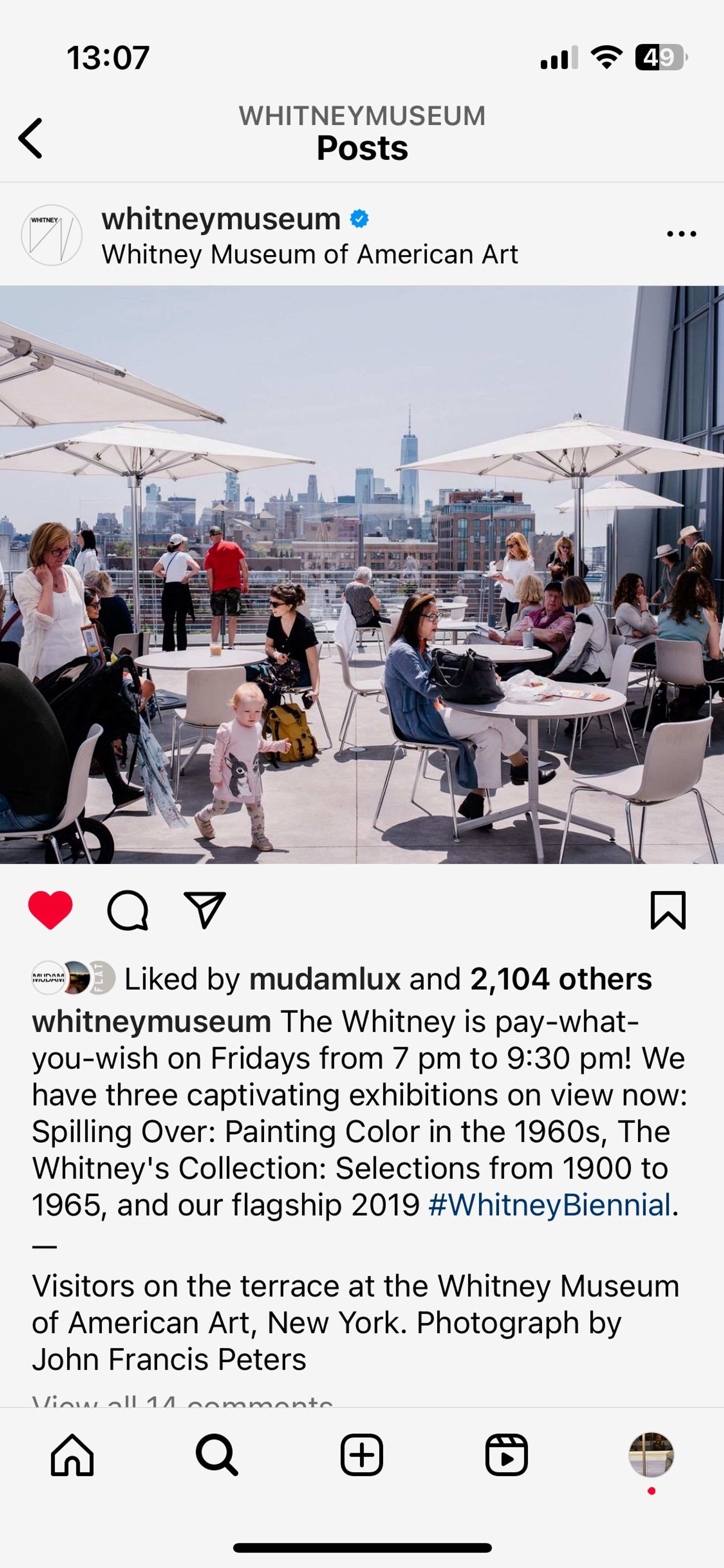 Screenshot of an instagram post featuring the Whitney terrace with tables and umbrellas and people sitting by the tables